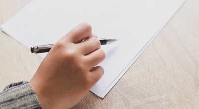 hand writing on blank paper 400x220 1