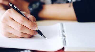 writing something in notebook 400x220 1